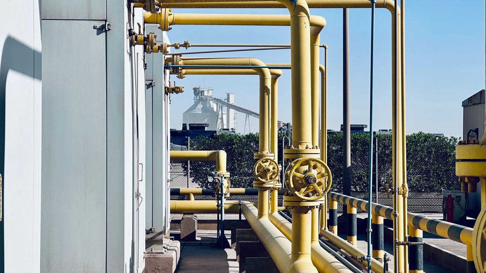 Industrial pipelines and valves at a processing plant in Saudi Arabia.